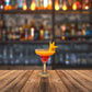 Frozen Mango Breeze Mocktail served in a glass with pineapple garnish
